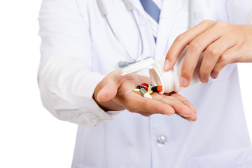 Asian male doctor with pills and pharmacy bottle