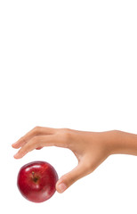 Girl hands reaching for a red apple over white background