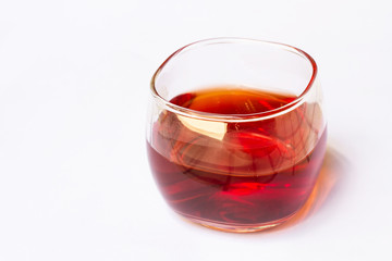 Tea in a glass on a white background.