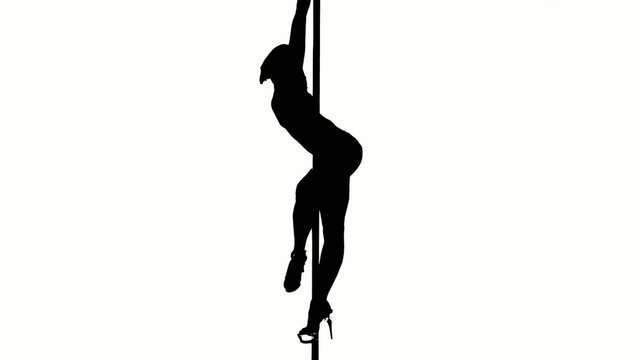 One caucasian woman pole dancer dancing in silhouette studio
