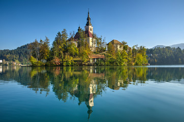 Bled island in sunny autumn afternoon