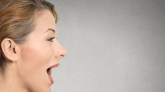 woman talking with sound coming out of her open mouth