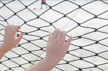 Hands with net, Hands with rope mesh fence