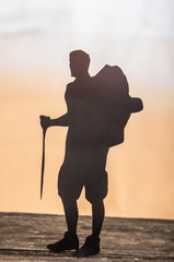 cut out of hiking man silhouette over nature background