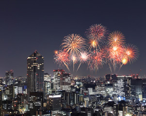 Fireworks celebrating over Tokyo cityscape at night