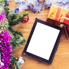 black tablet on table wood with christmas decoration