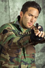 soldier militar latin man pointing a gun