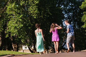 Fototapeta premium Boy Girls Walking Away Talking