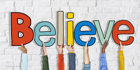 Group of Hands Holding Letter Believe
