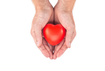 male hand holding a heart