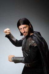 Angry warrior against dark background