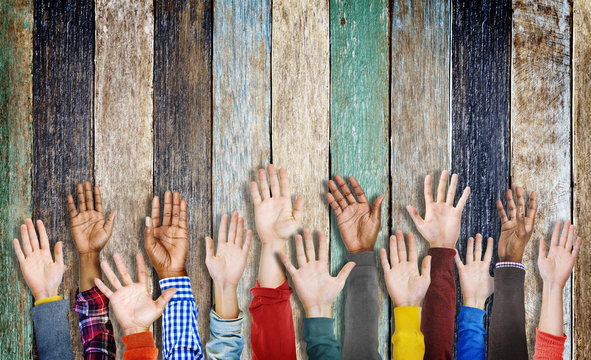Group of Diverse Hands Raised