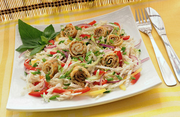 Scrambled eggs with green onions, fresh vegetables and sesame se