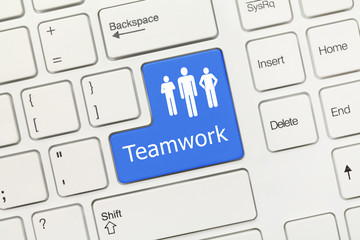 White conceptual keyboard - Teamwork (blue key)