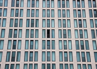 Fototapeta na wymiar Modern building facade with one open window