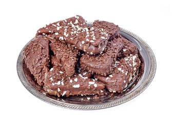 Pieces chocolate dessert on a tray, isolated white background