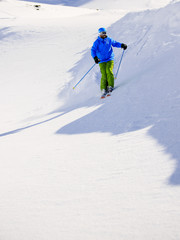 Skiing, Skier, Freeski,  Freeride in fresh powder snow