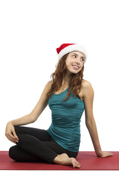Christmas yoga woman doing spinal twist