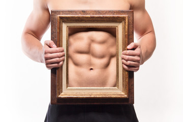 Muscular man with six-pack and frame on his torso
