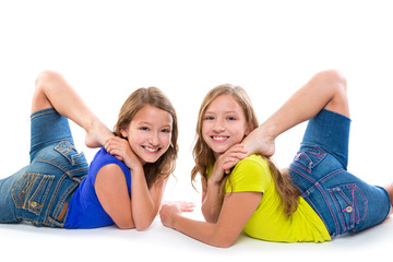 twin kid sisters symmetrical flexible playing happy