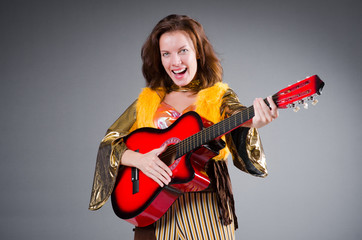 Guitar player with red instrument
