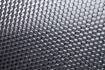 Honeycomb grid against grey background.