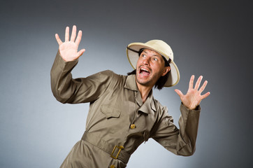 Funny safari hunter against background
