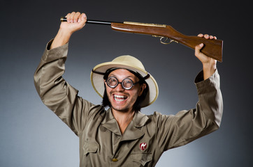 Funny safari hunter with rifle