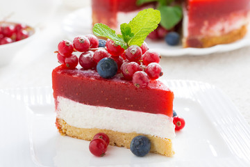 piece of cheesecake with berry jelly, close-up