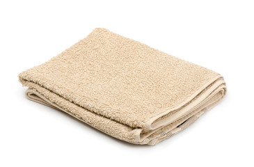 Fototapeta na wymiar Folded beige terry towel