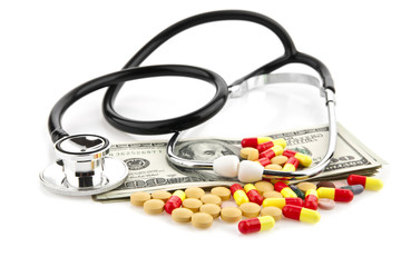 pills, dollars and stethoscope