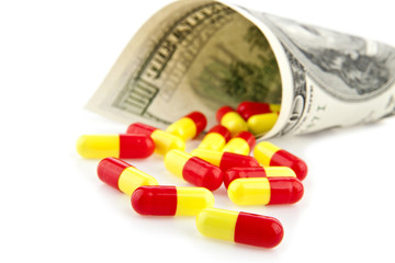 money rolled up with pills flowing out