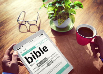 Man Reading the Definition of Bible
