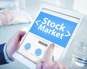 Hand on Digital Tablet Stock Market Concept