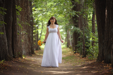 bride wedding a walk in the park in the woods