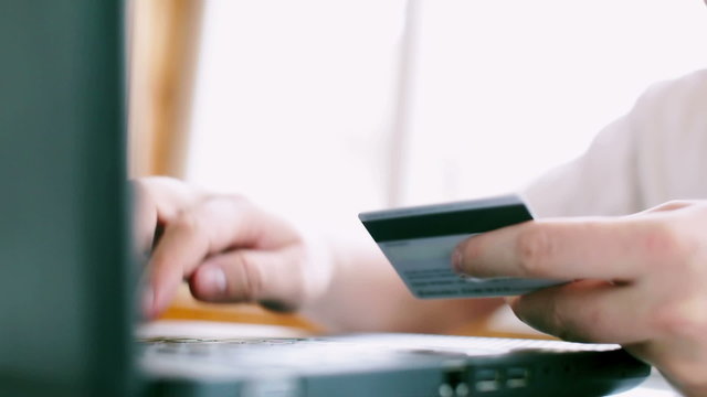 Man is using credit card for online payment