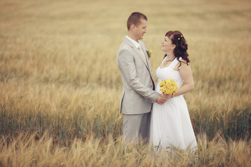 wheat field wedding bride and groom walk