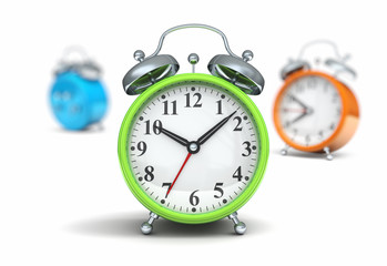 Green alarm clock in focus