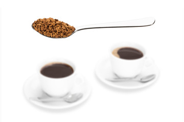 Small instant coffee chunks and two coffee cups