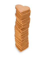 Stack of gingerbread hearts on white background.