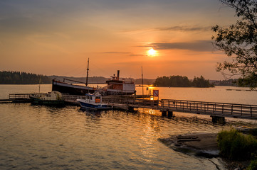 Obraz premium Old ships at sunset