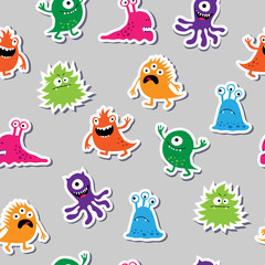 Obraz premium Seamless pattern with colorful appliques monsters