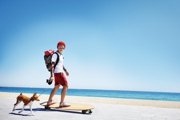 man looking like a santa ride on a longboard