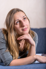 Close up face portrait of young brunette looking up