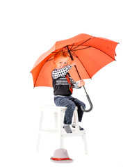 Boy with umbrella studio shot on a white background