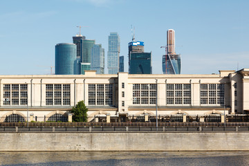 Power station at embankment and skyscrapers © miklyxa