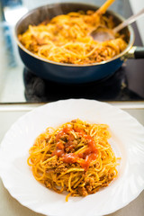 Proces of preparing spaghetti Bolognese