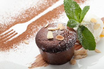 Warm chocolate cake Fondant with ice-cream ball, almond, mint, c