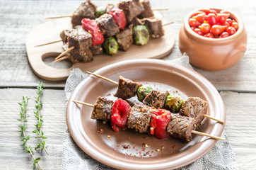 Grilled beef skewers with pepper and brussels