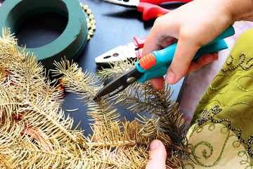 Woman making christmas wreath